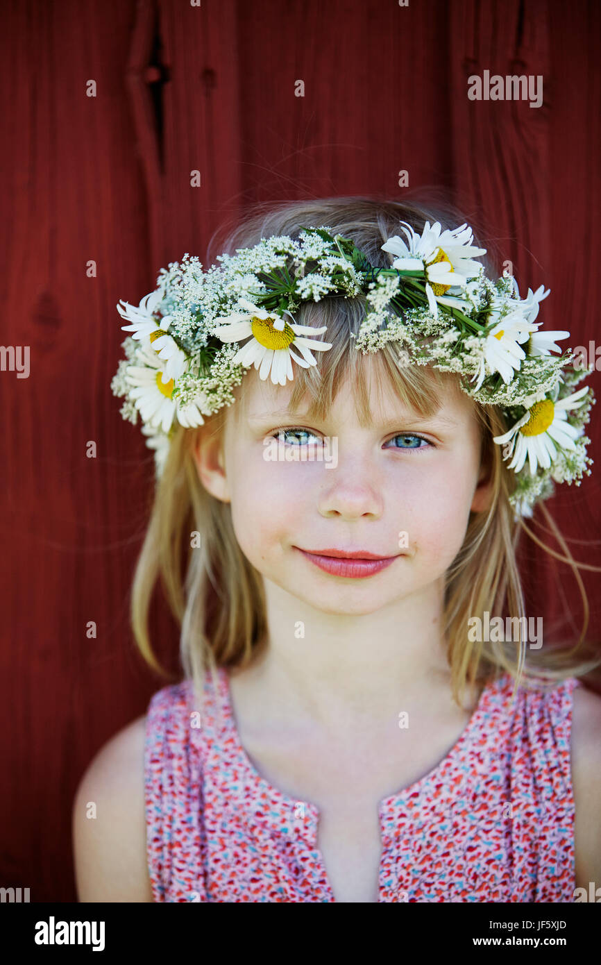 Portrait of girl wearing flower wreath Stock Photo - Alamy