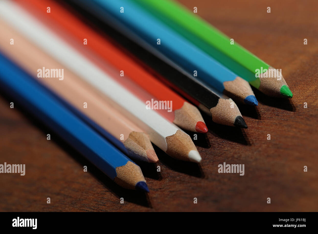 Colorful pencils lying on a table Stock Photo Alamy