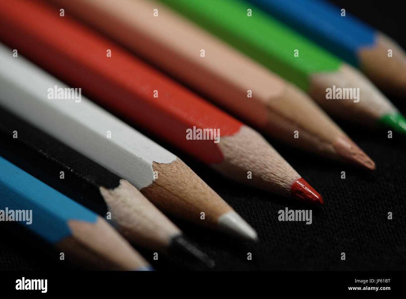 Colorful pencils lying on a table Stock Photo