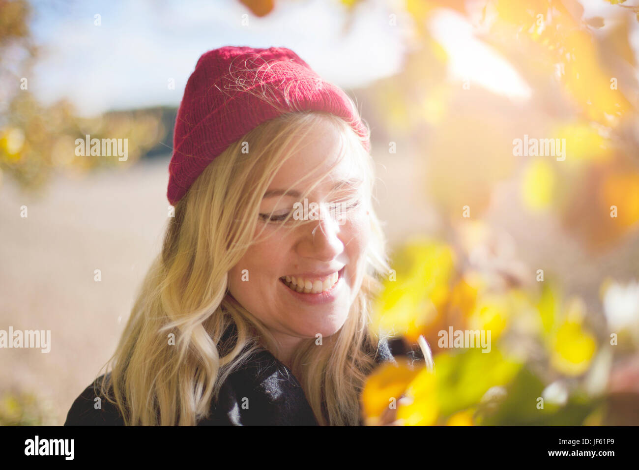 Young woman woolly hat smile hi-res stock photography and images - Alamy