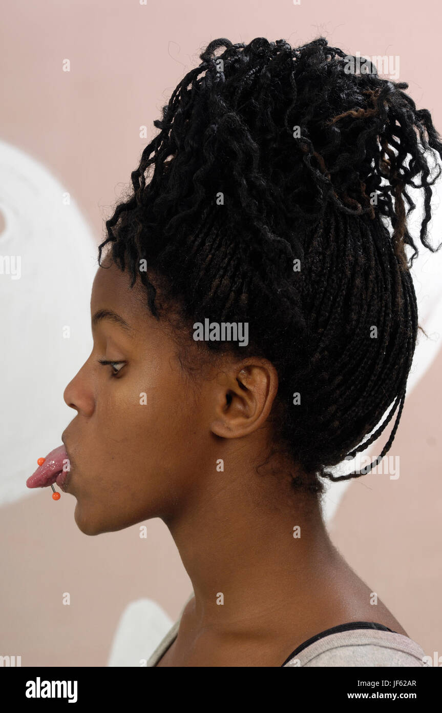 Teenage girl with a pierced tongue Stock Photo Alamy