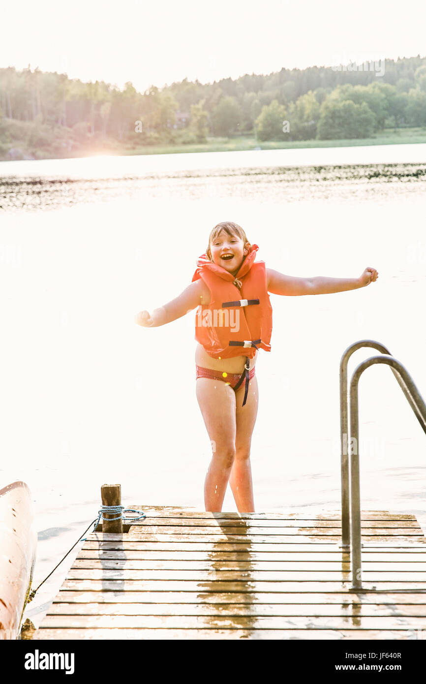 Smiling girl at water Stock Photo - Alamy