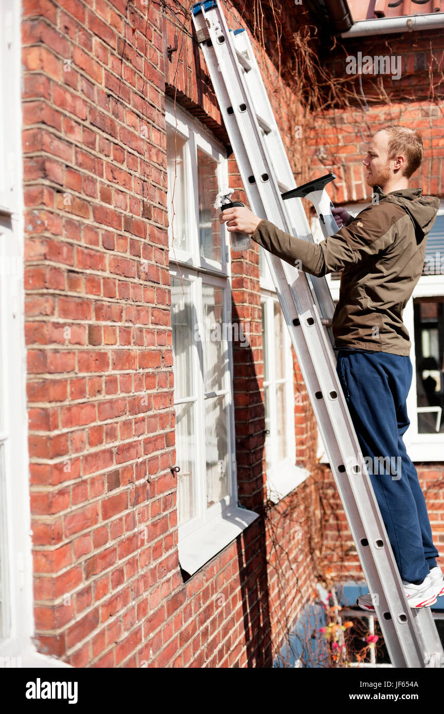 Man On A Ladder Stock Photo - Download Image Now - Ladder, Window Washer,  Danger - iStock