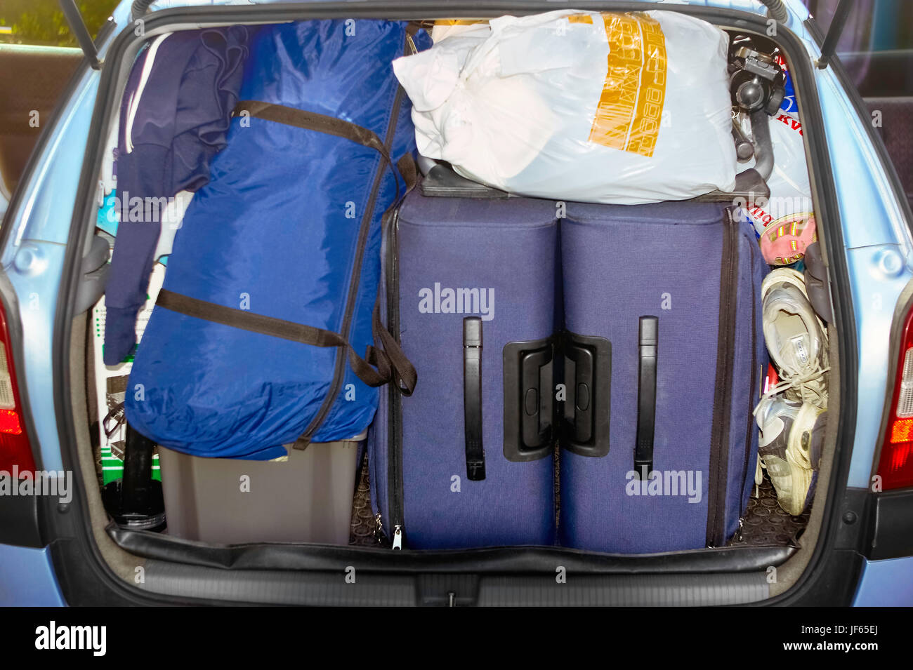 Luggage in car trunk Stock Photo