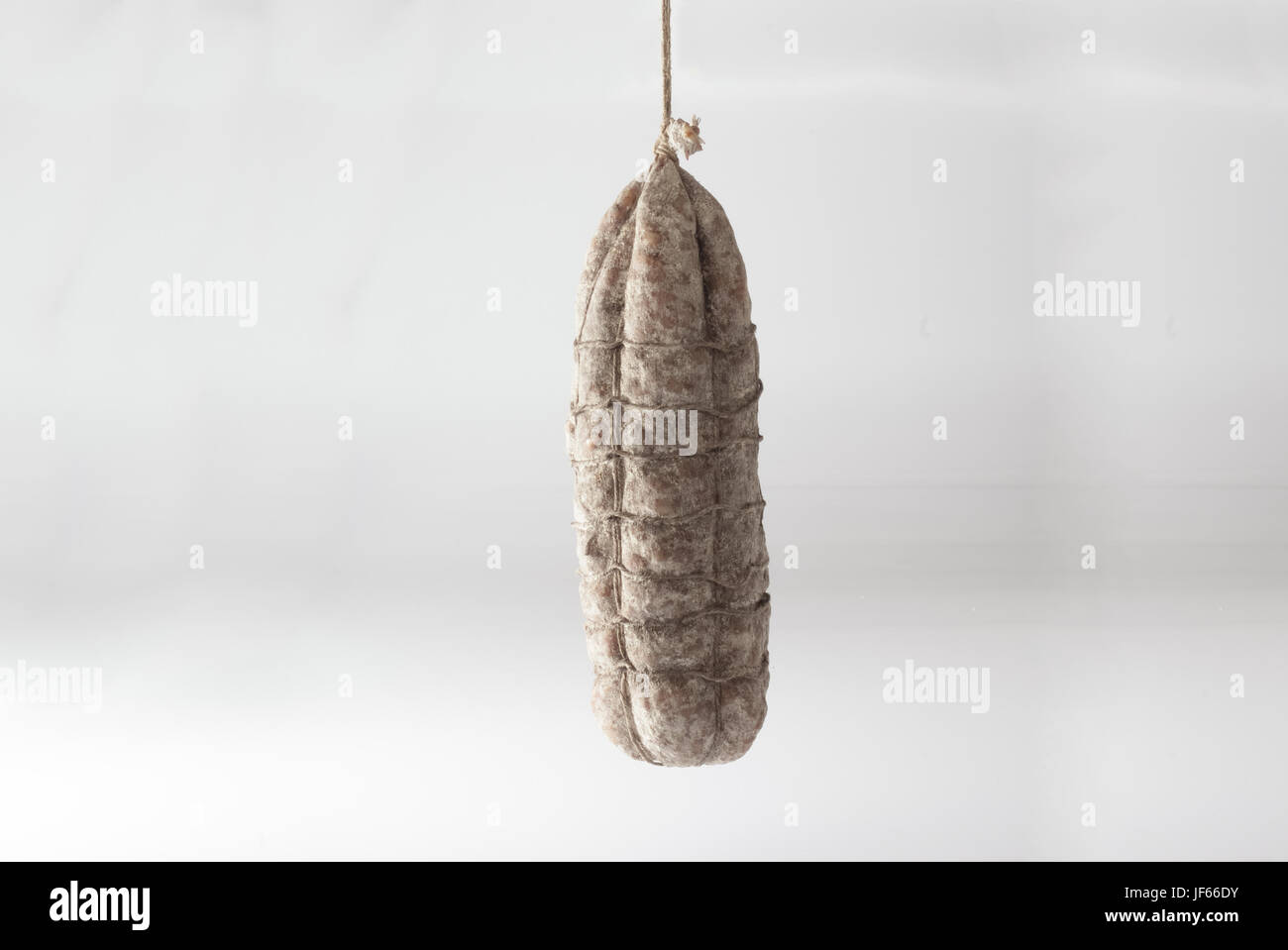 Salami hanging white background Stock Photo Alamy