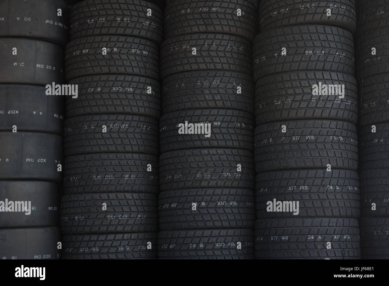Racing black tires pile background Stock Photo