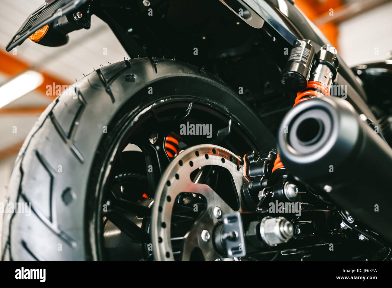 Front motorcycle disk breaks and tire in close up. New shiny brake