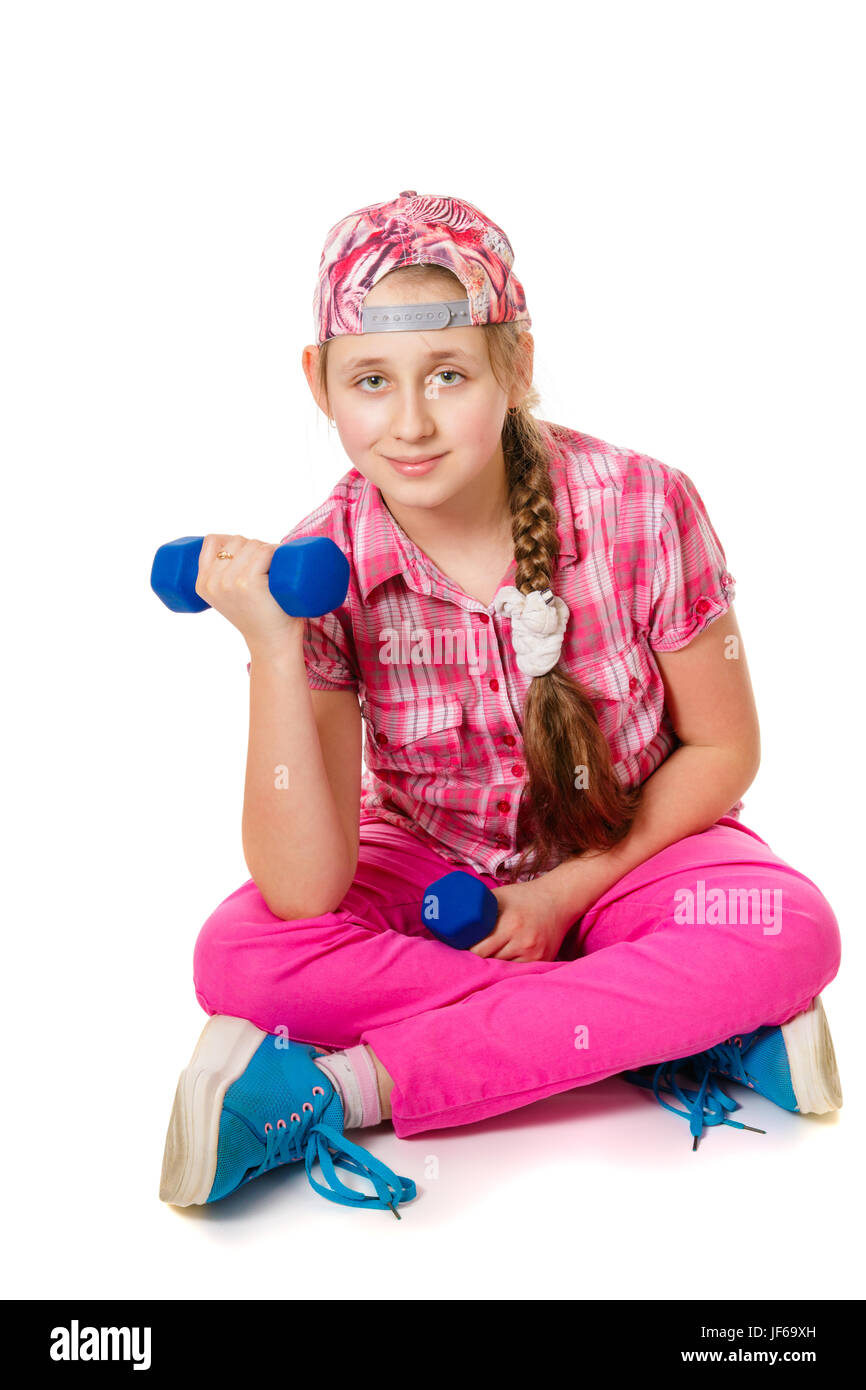 Girl doing exercises with dumbbells. Isolated on a white Stock Photo