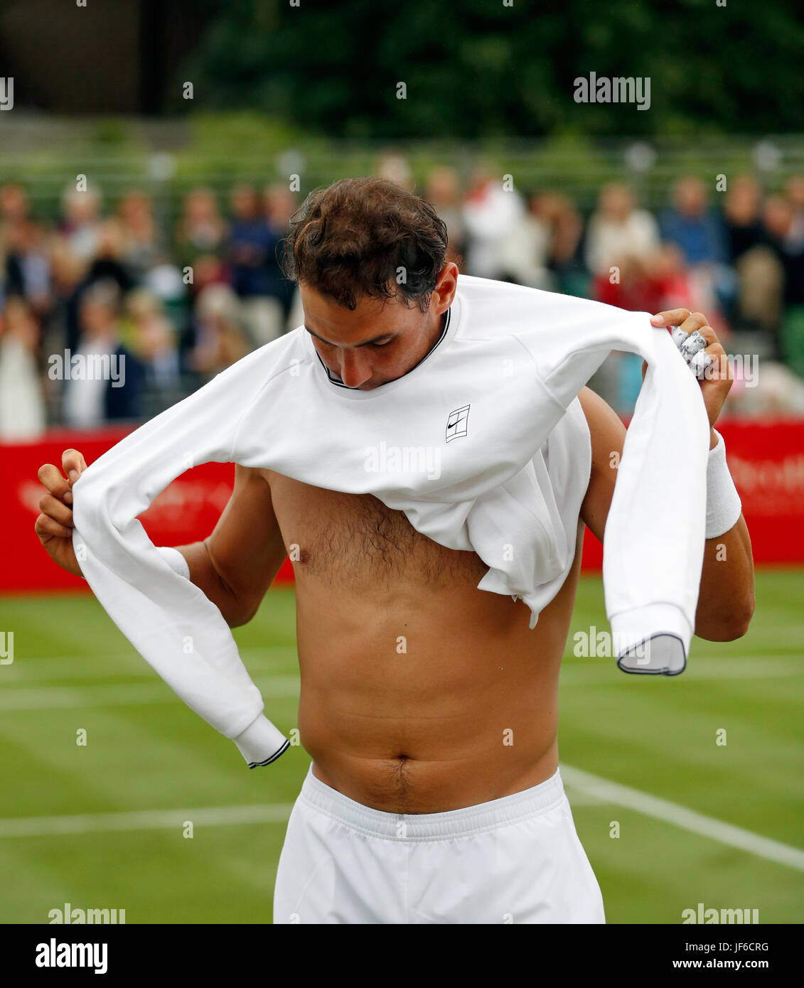 Spain's Rafael Nadal changes his shirt at an exhibition tennis match in London June 2017 Stock Photo