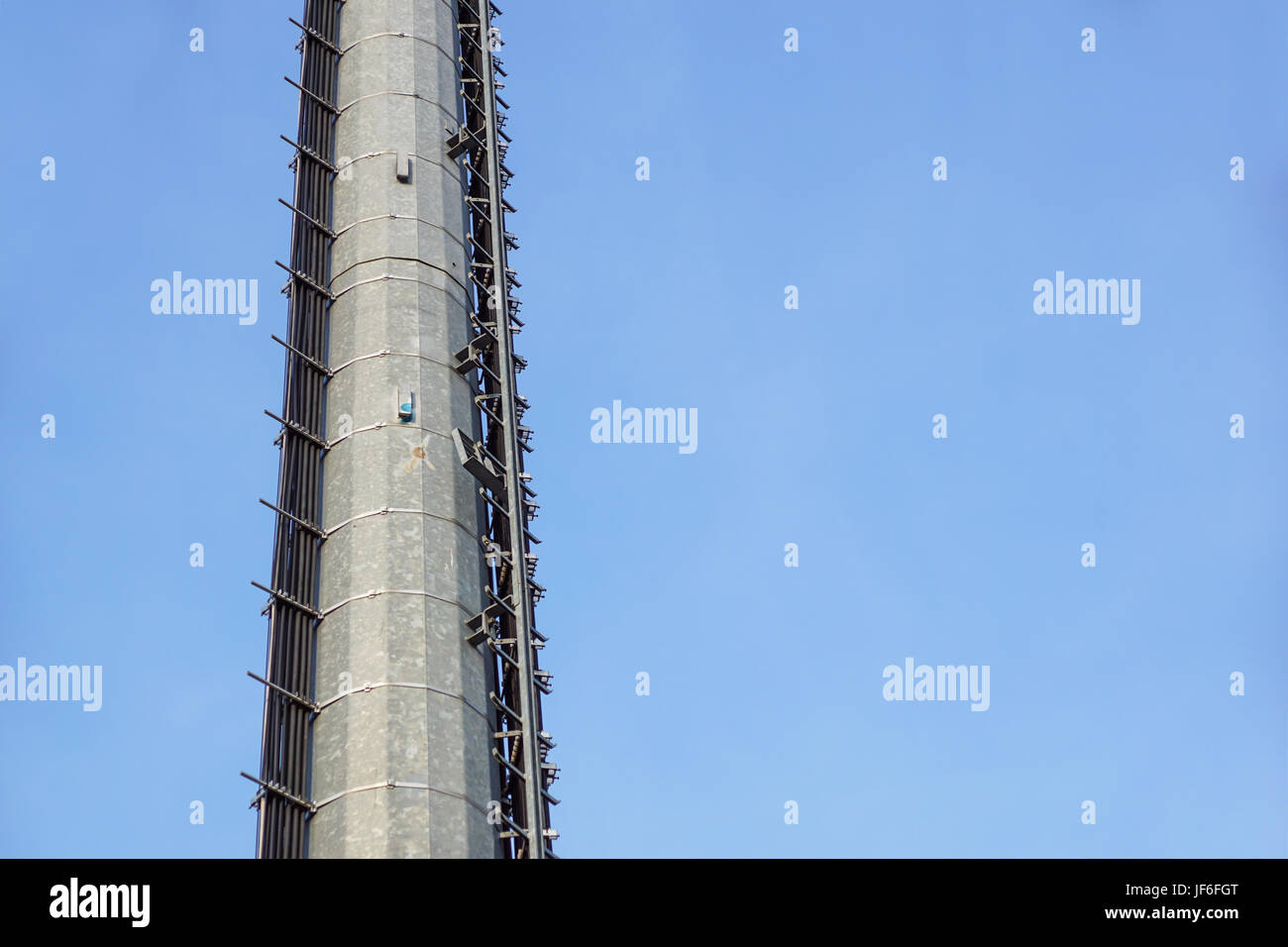 stairs to the comunications pole with wires and cable . Stock Photo