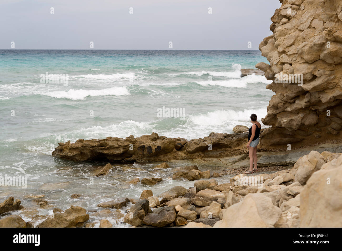 Woman watching waves hi-res stock photography and images - Alamy