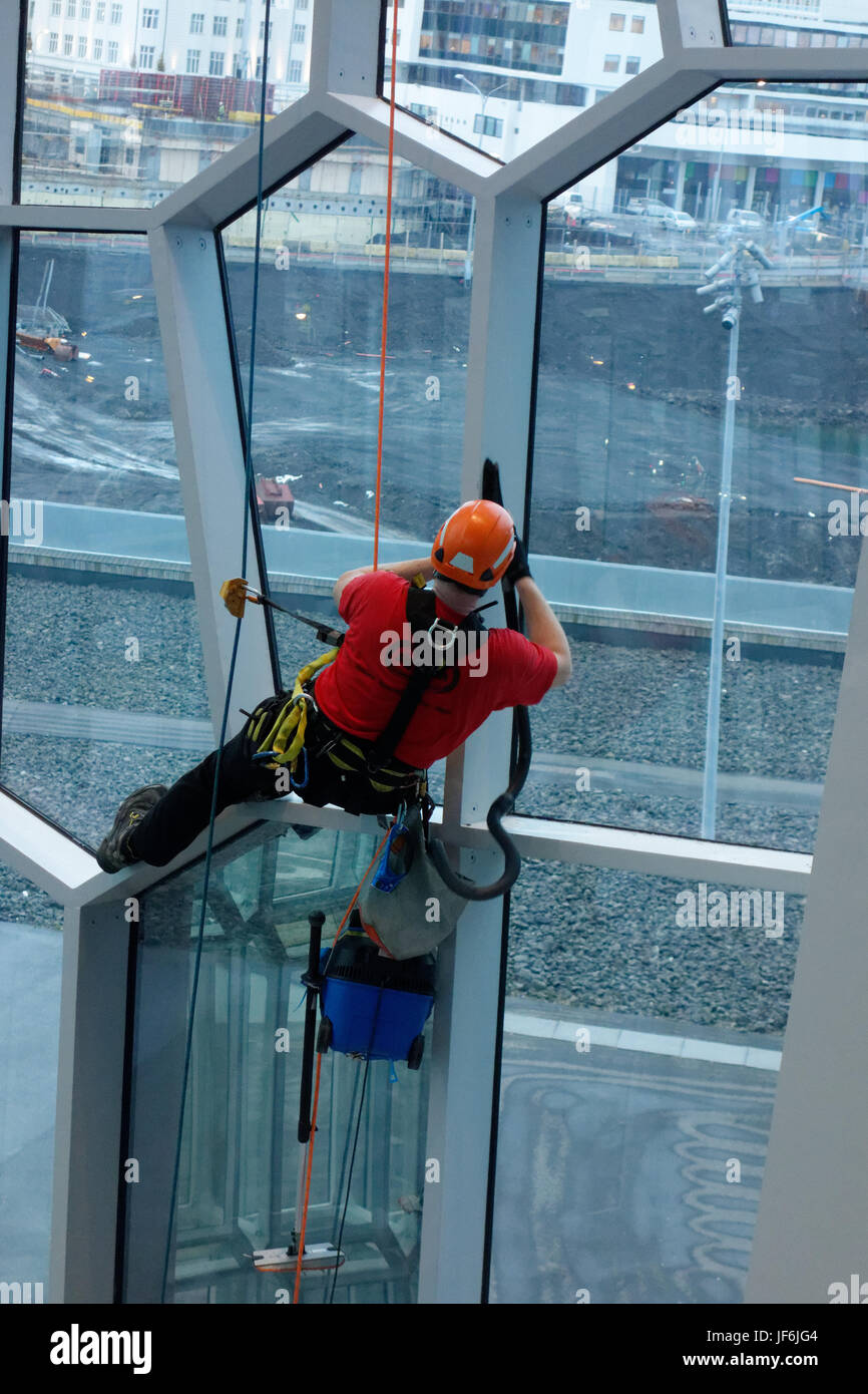 Window Cleaners at the Harpa Concert Hall and Conference Centre Reyjavik, Iceland. Stock Photo