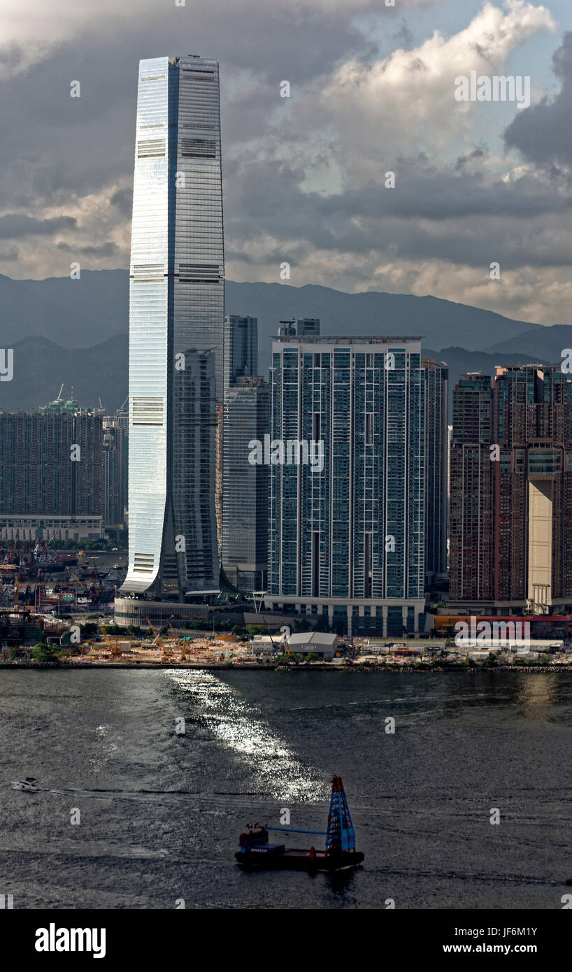 The International Commerve Cenre tower in Kowloon, Hong Kong SAR shinig on the harbour Stock Photo