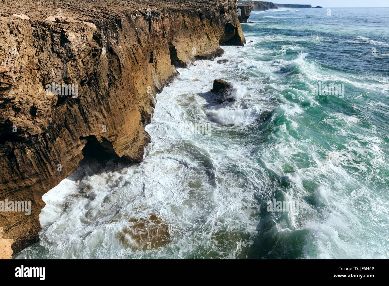 Waves breaking on rocky coast Stock Photo - Alamy