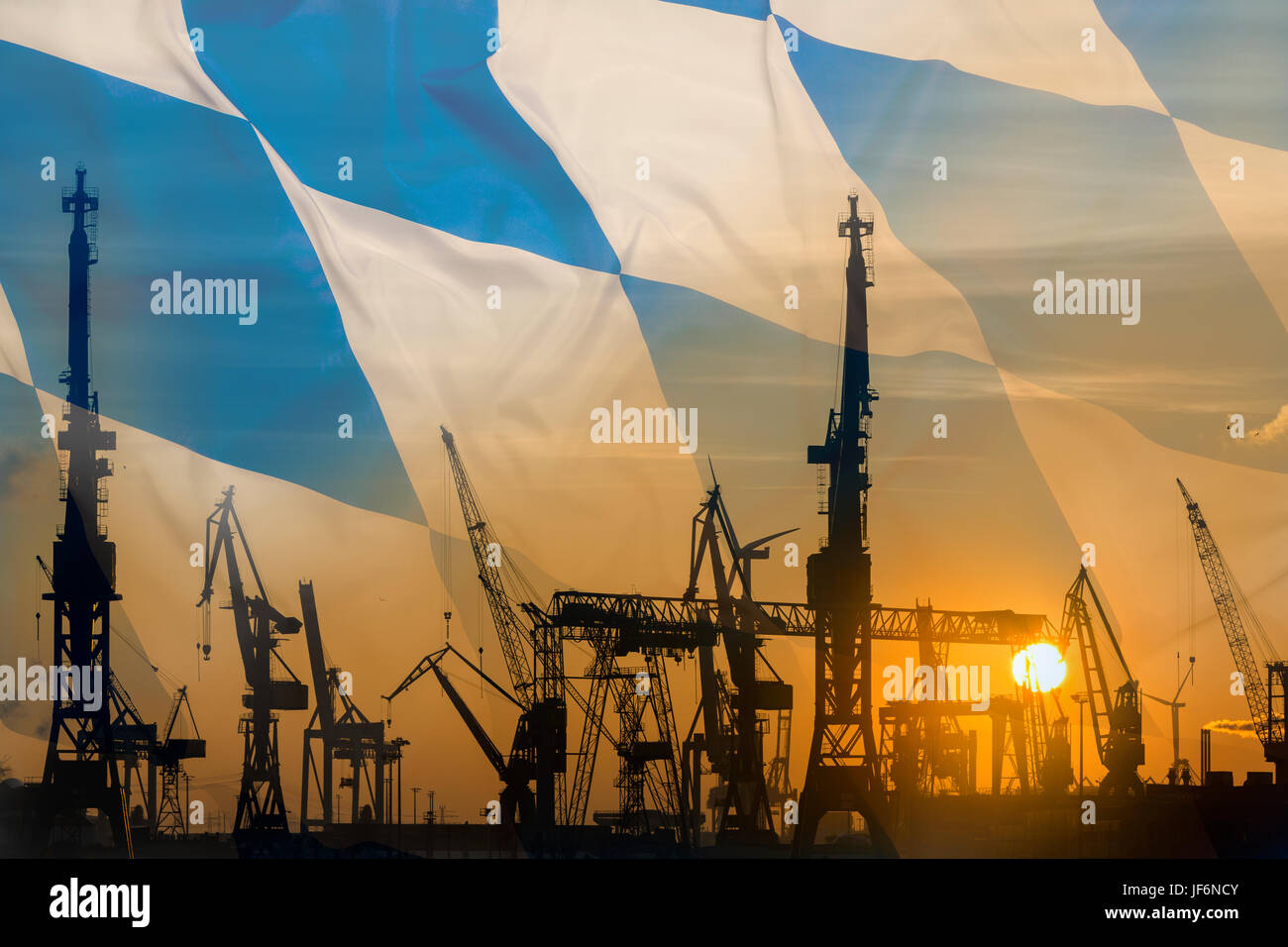 Industrial concept with Bavarian flag at sunset, silhouette of container harbor Stock Photo