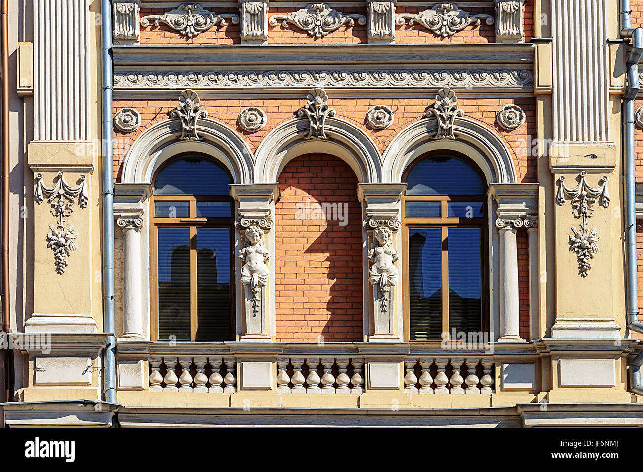 Window Relief Design Two window decorated with bas-relief Stock Photo - Alamy