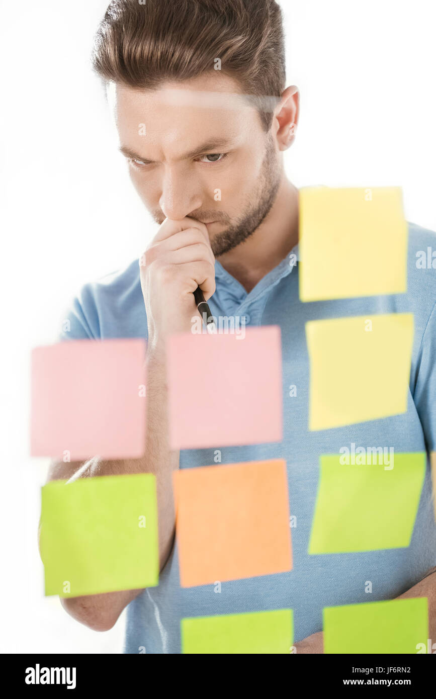 thoughtful casual businessman working on new project at office, business establishment Stock Photo