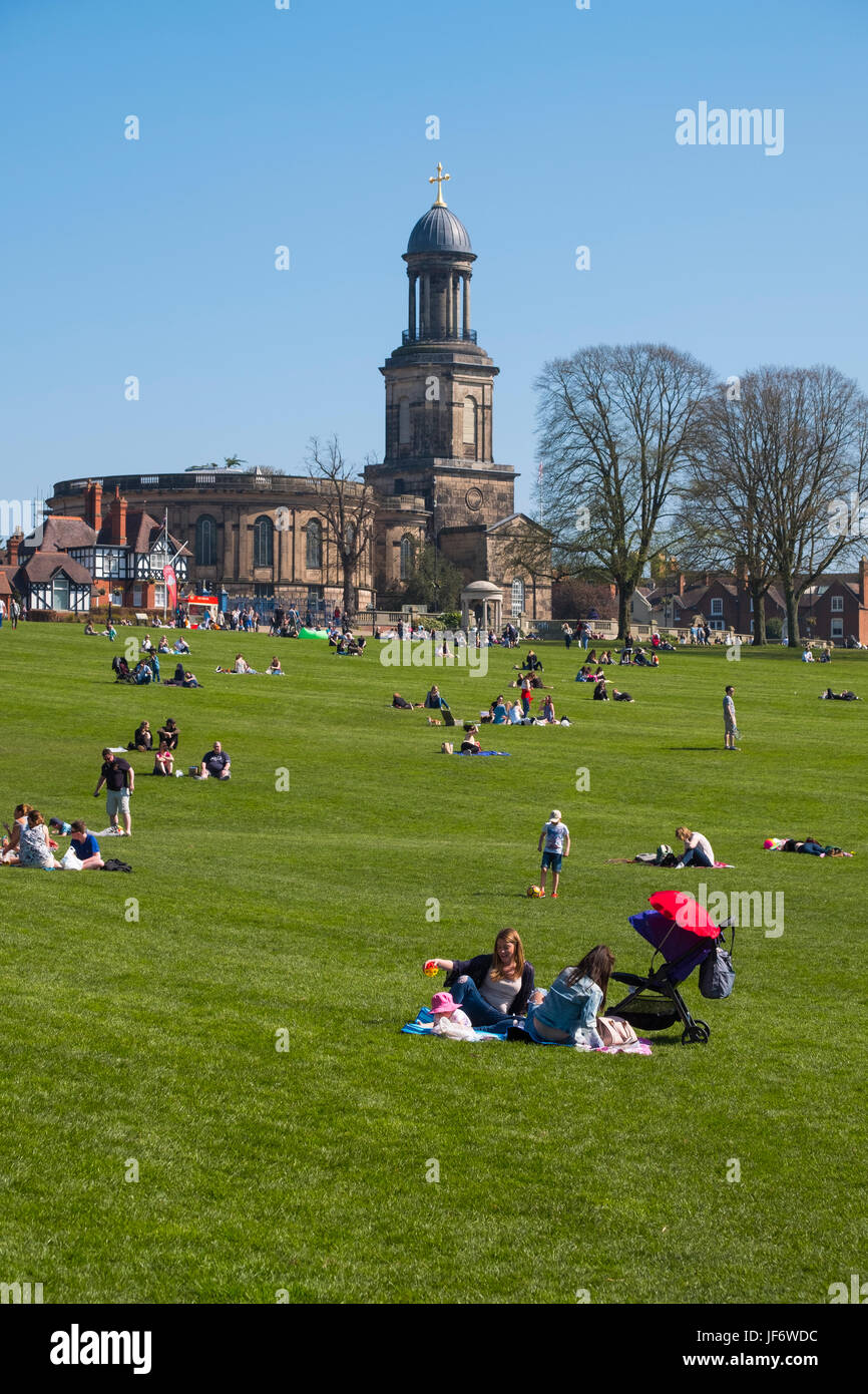 Families enjoying sunshine in The Quarry at Shrewsbury overlooked by St Chad's church, Shropshire, England, UK Stock Photo