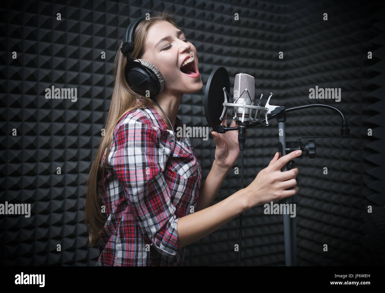 Singer with headphones Stock Photo