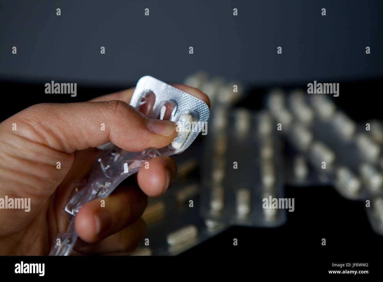 A woman holding Neurontin 100mg, Gabapentin Stock Photo