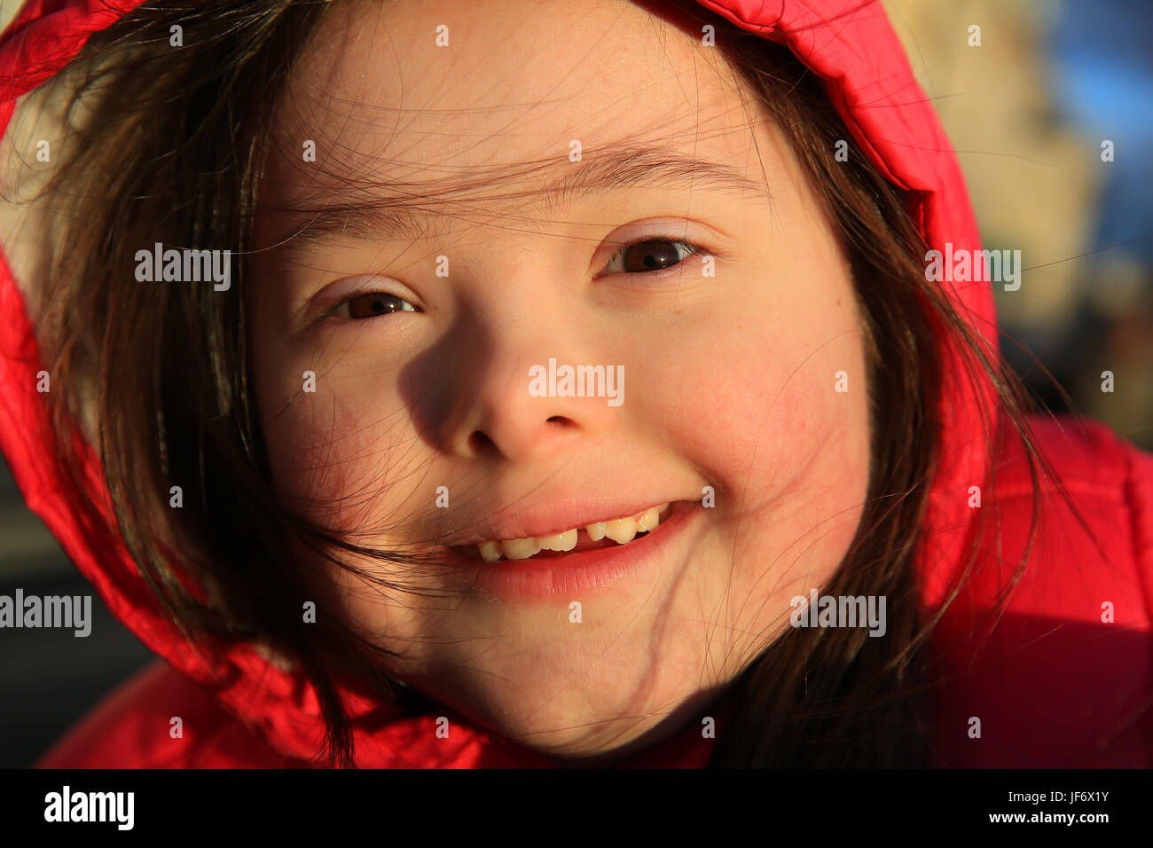 Portrait of little girl smiling outside Stock Photo - Alamy