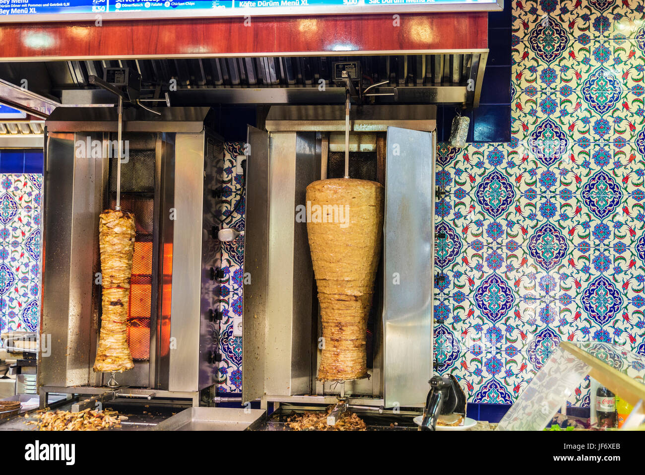 Berlin, Germany - April 12, 2017: Kitchen of a Doner kebap with rolls of mutton or chicken in Berlin, Germany Stock Photo