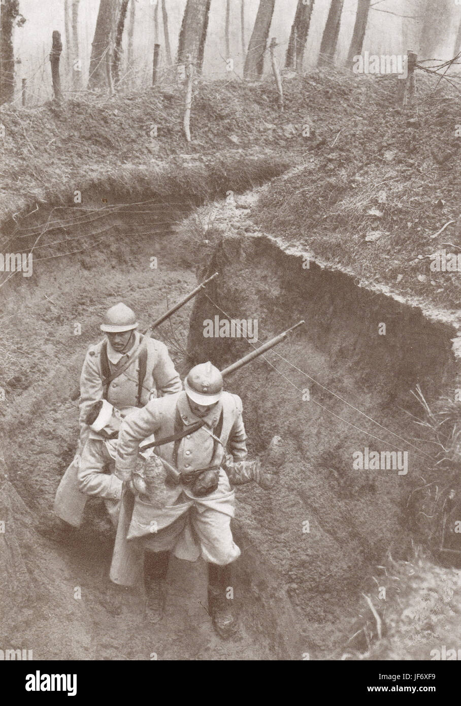 French soldiers carrying a wounded man from the firing Line Stock Photo