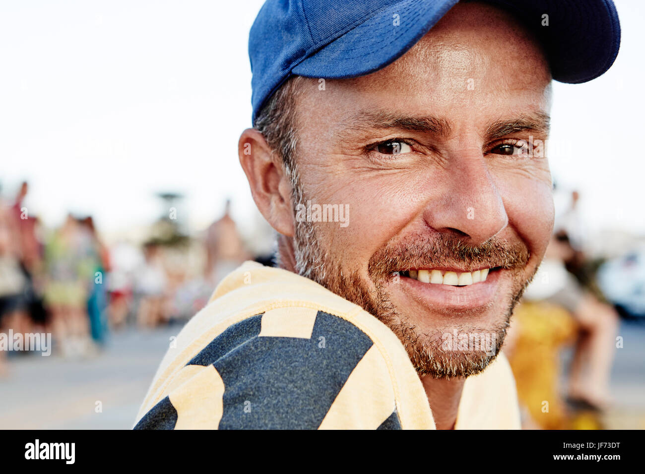 Portrait of smiling man wearing cap Stock Photo Alamy
