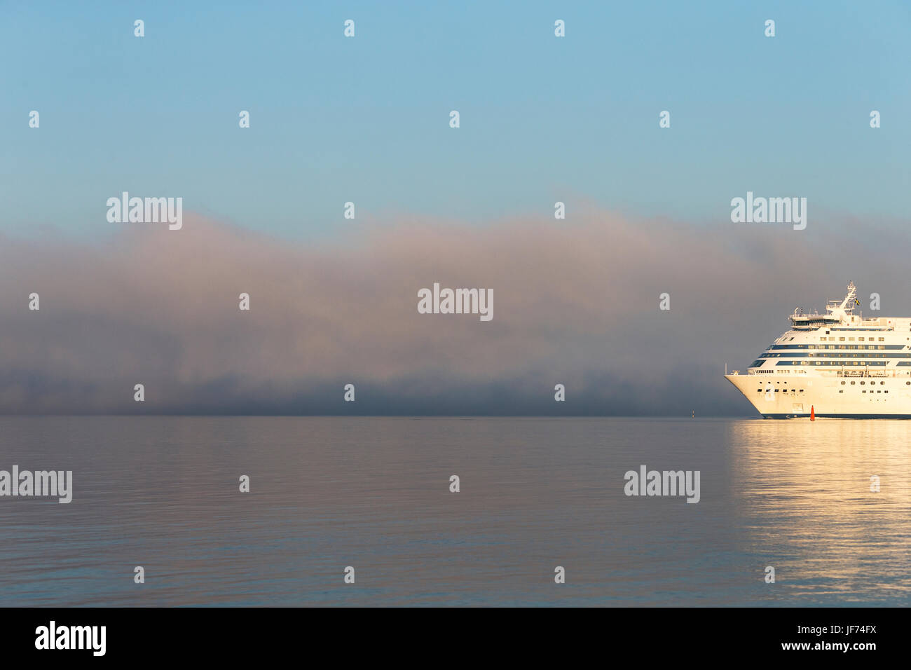 Cruise ship on sea at sunset Stock Photo - Alamy