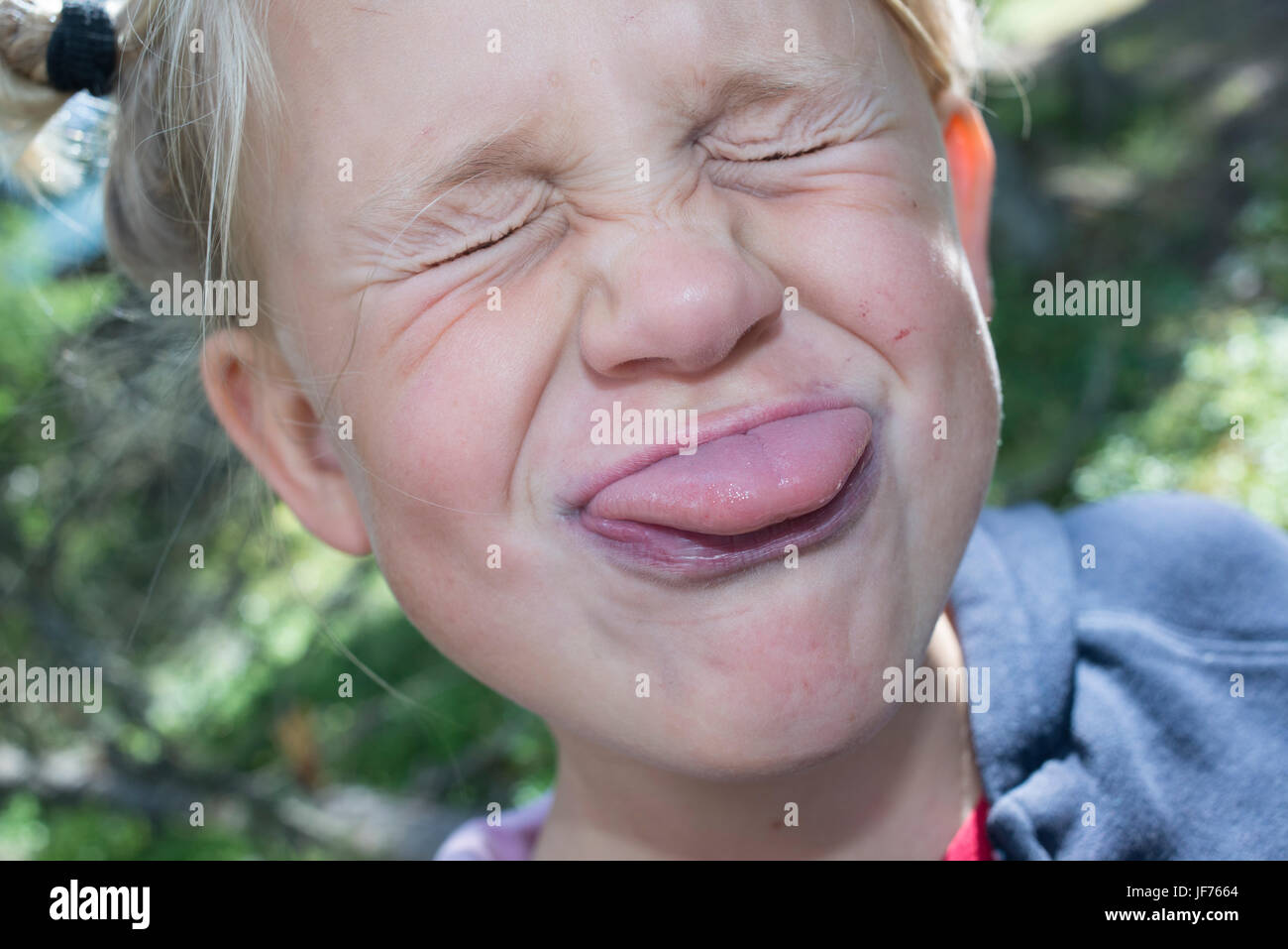 Girl making funny facial expression Stock Photo Alamy