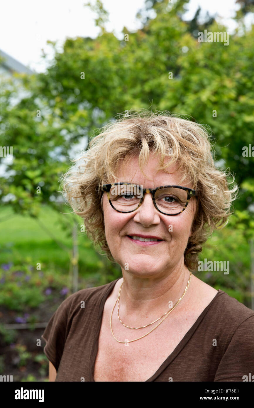 Mature woman curly hair glasses hi-res stock photography and images - Alamy