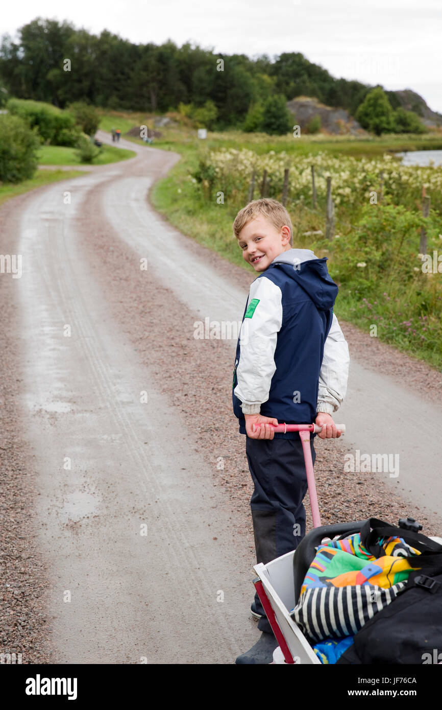 Boy pulling wagon hi-res stock photography and images - Alamy
