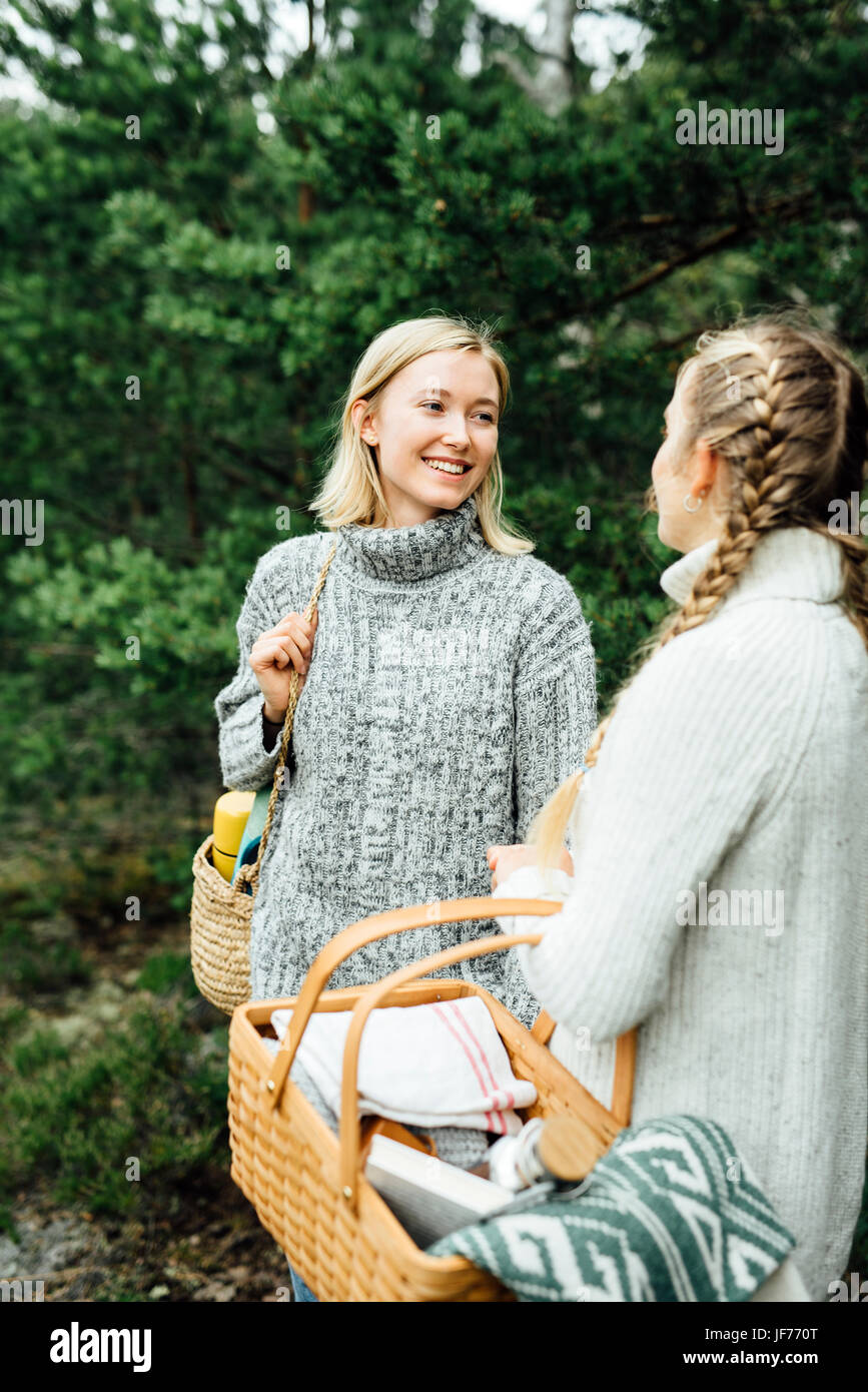 Two women in the forest Stock Photo - Alamy