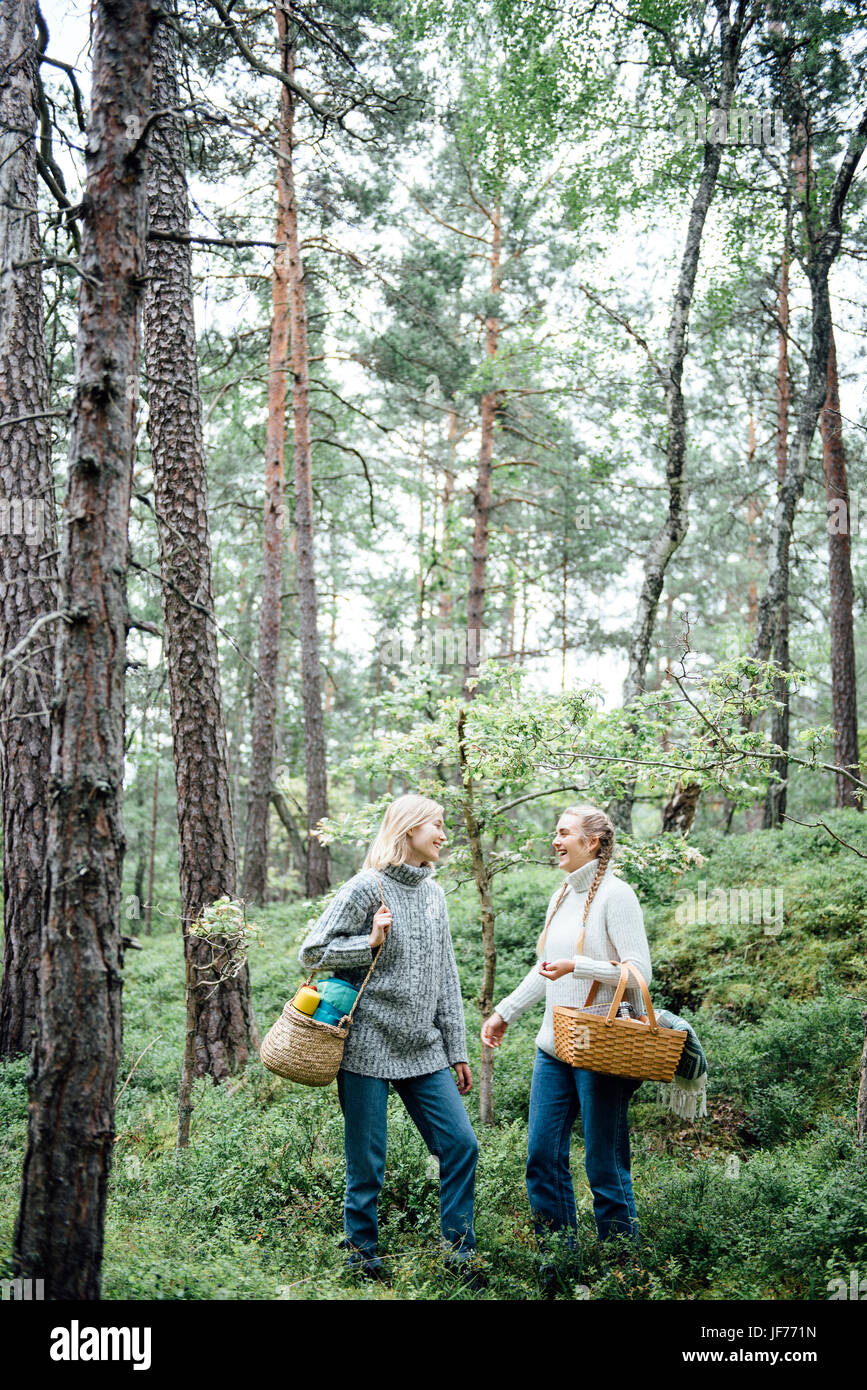 Two women in the forest Stock Photo - Alamy