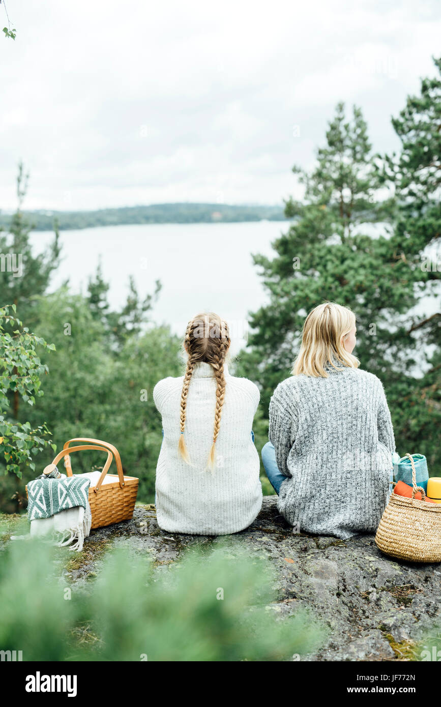 Two women in the forest Stock Photo - Alamy