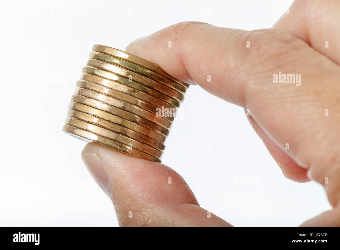 hand holding golden coins with white background Stock Photo - Alamy