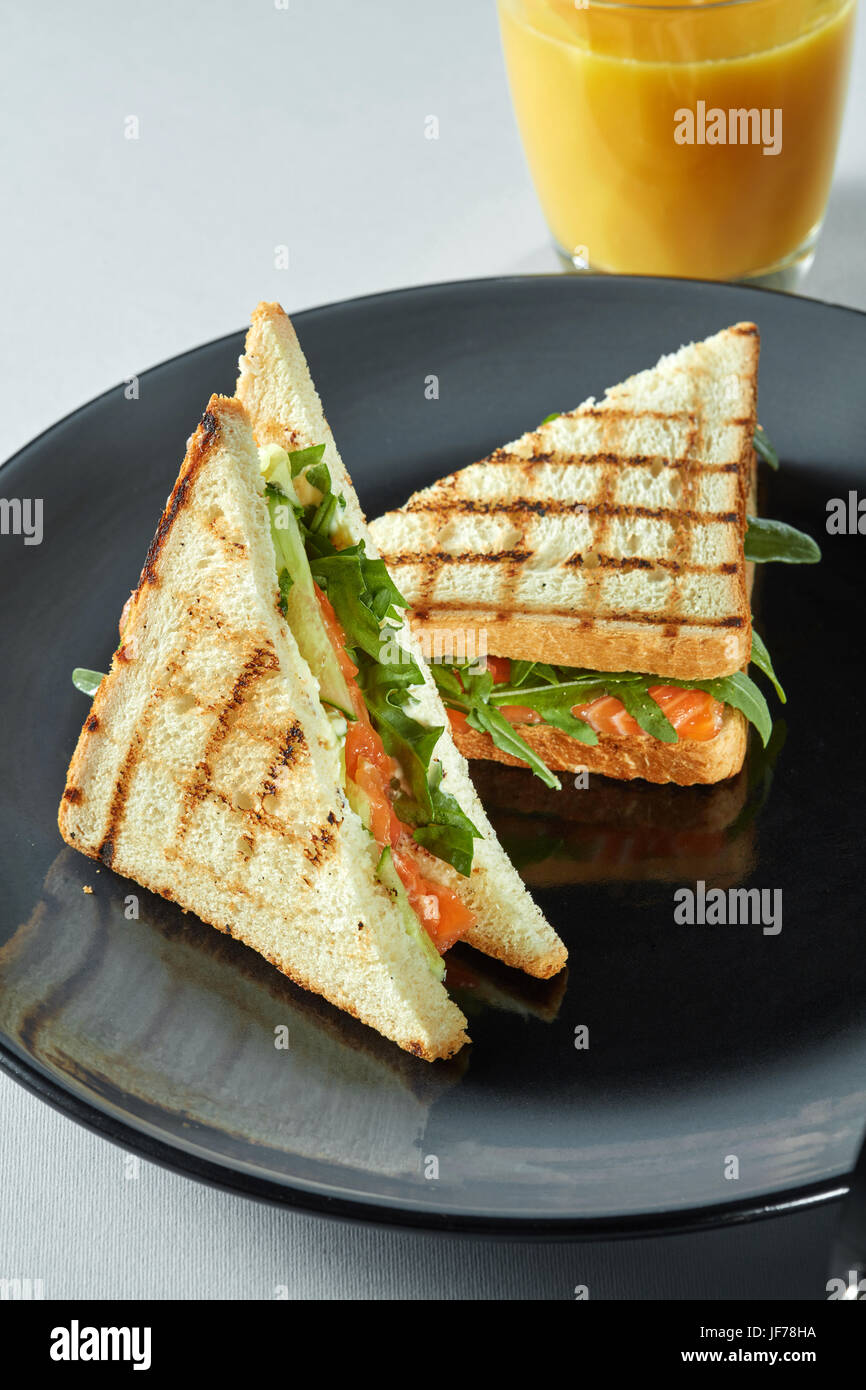 grilled salmon sandwich with juice Stock Photo Alamy