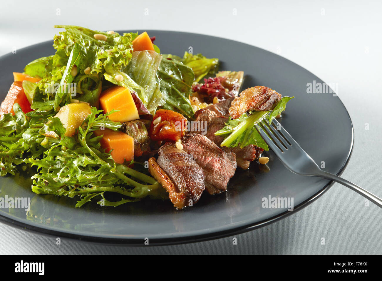 salad with pumpkin on white background Stock Photo