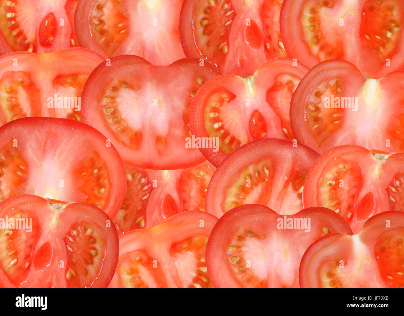Background made from lot of freshness red sliced tomatoes Stock Photo