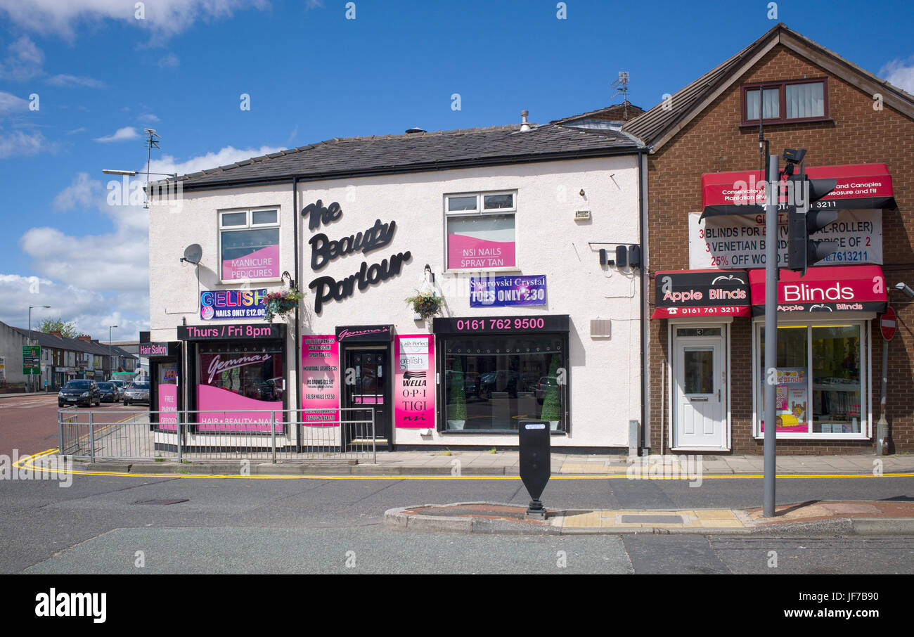 Beauty parlour and window blinds shop at junction of Rochdale road and