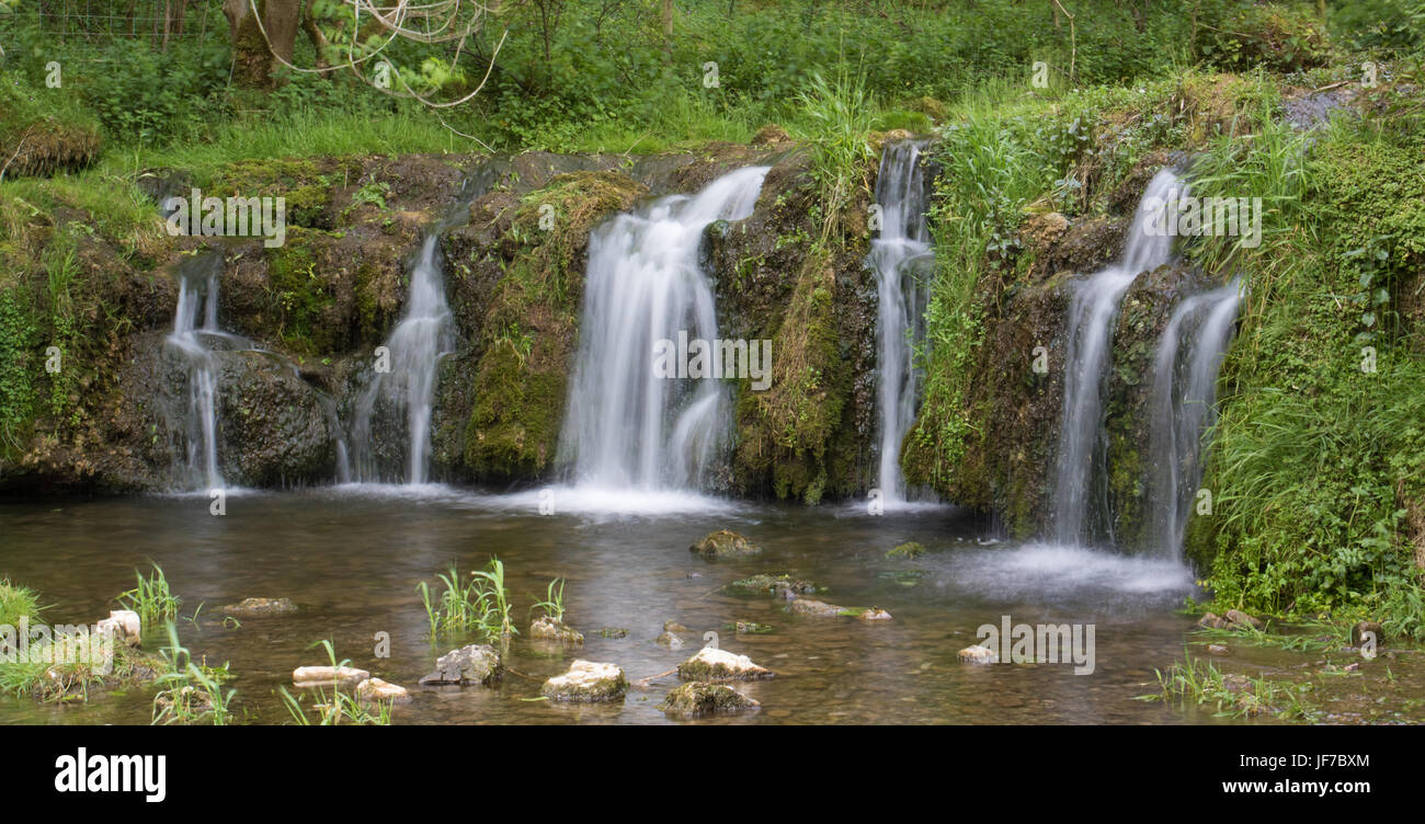 waterfall on the River Lathkill in Lathkill Dale, Peak District National Park, UK Stock Photo