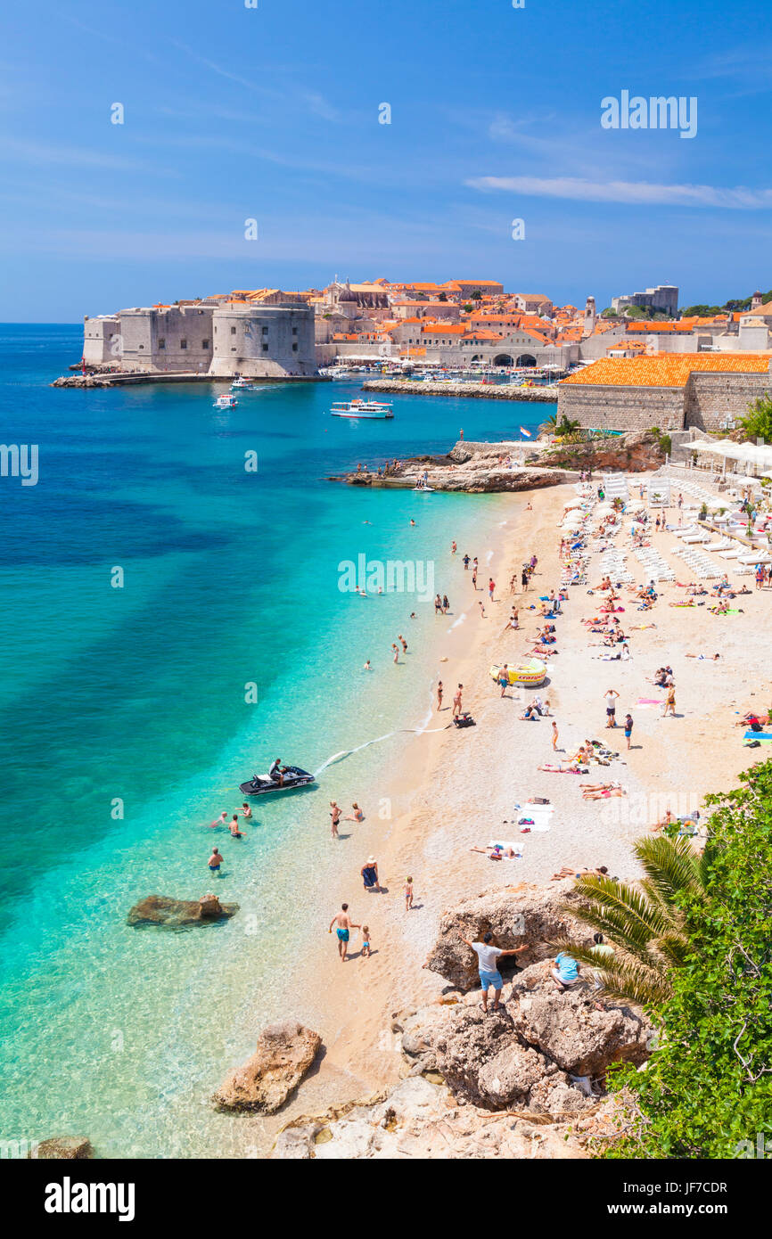 people holidaymakers tourists sunbathing on Banje beach banje Dubrovnik croatia Dalmatian Coast Dubrovnik riviera Adriatic sea adriatic coast Stock Photo