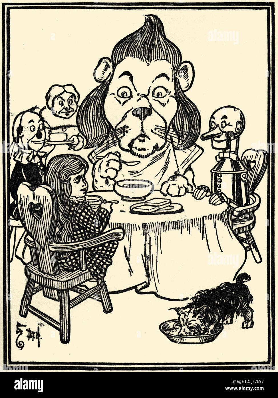 The Wizard of Oz by L. Frank Baum book . Illustration by W.W. Denslow. Caption: The Lion ate some of the porridge. (on the way to the Emerald City)Published by Bobbs Merill. American author, 15 May 1856 – 6 May 1919 Stock Photo