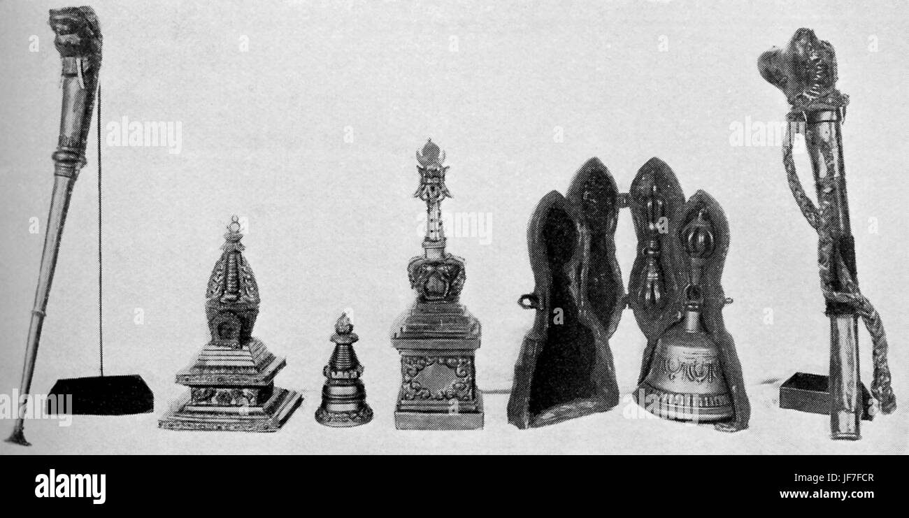 Collection of Tibetan Buddhist ceremonial instruments, including: a brass and silver trumpet (chaunk), bone trumpet, three small decorated choten, dorje and drilbu in case (sceptre and bell). Stock Photo