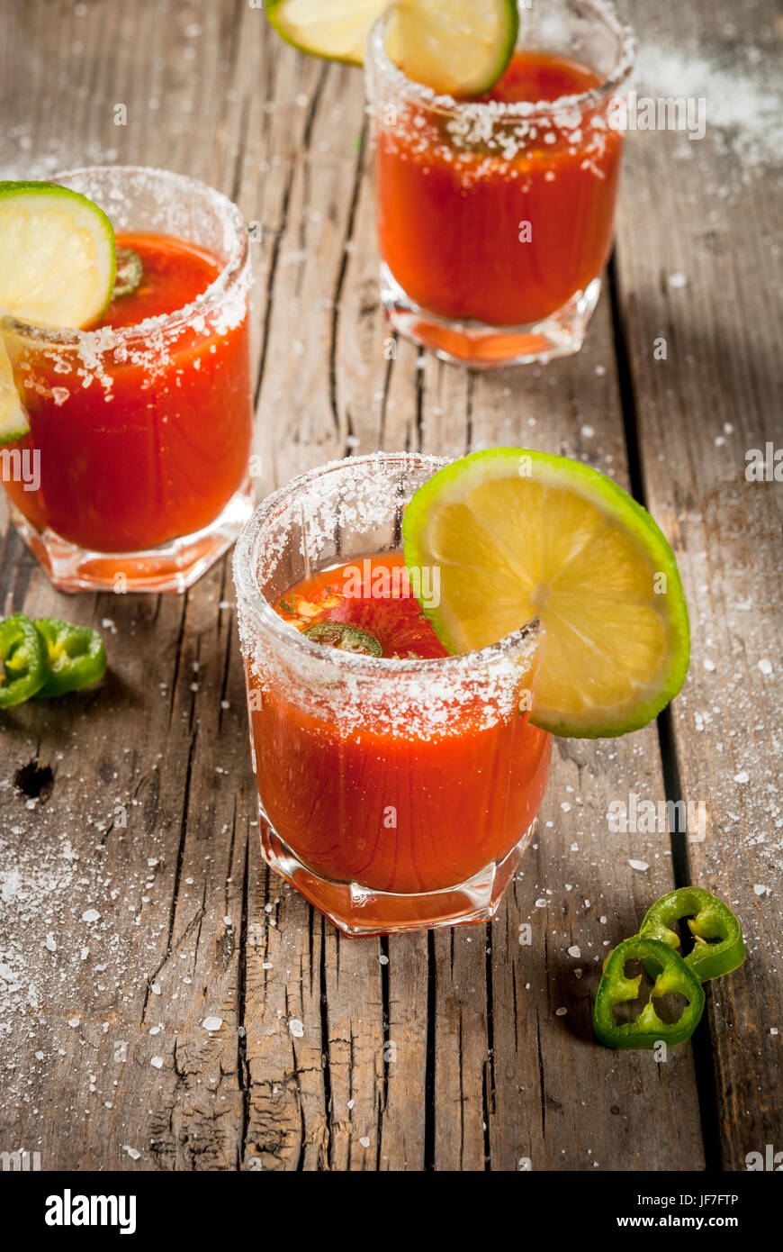 Mexican traditional alcohol drink. Sangrita, with tequila, tomato juice