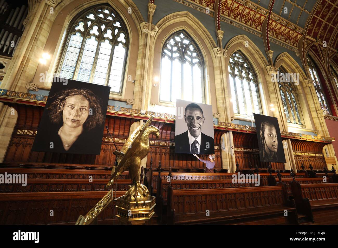 Final adjustments are made to the first ever art exhibition to be curated in St Cuthbert&Otilde;s Chapel at Ushaw in Durham, six two-metre high tapestry portraits from American hyper-realist artist Chuck Close. Stock Photo