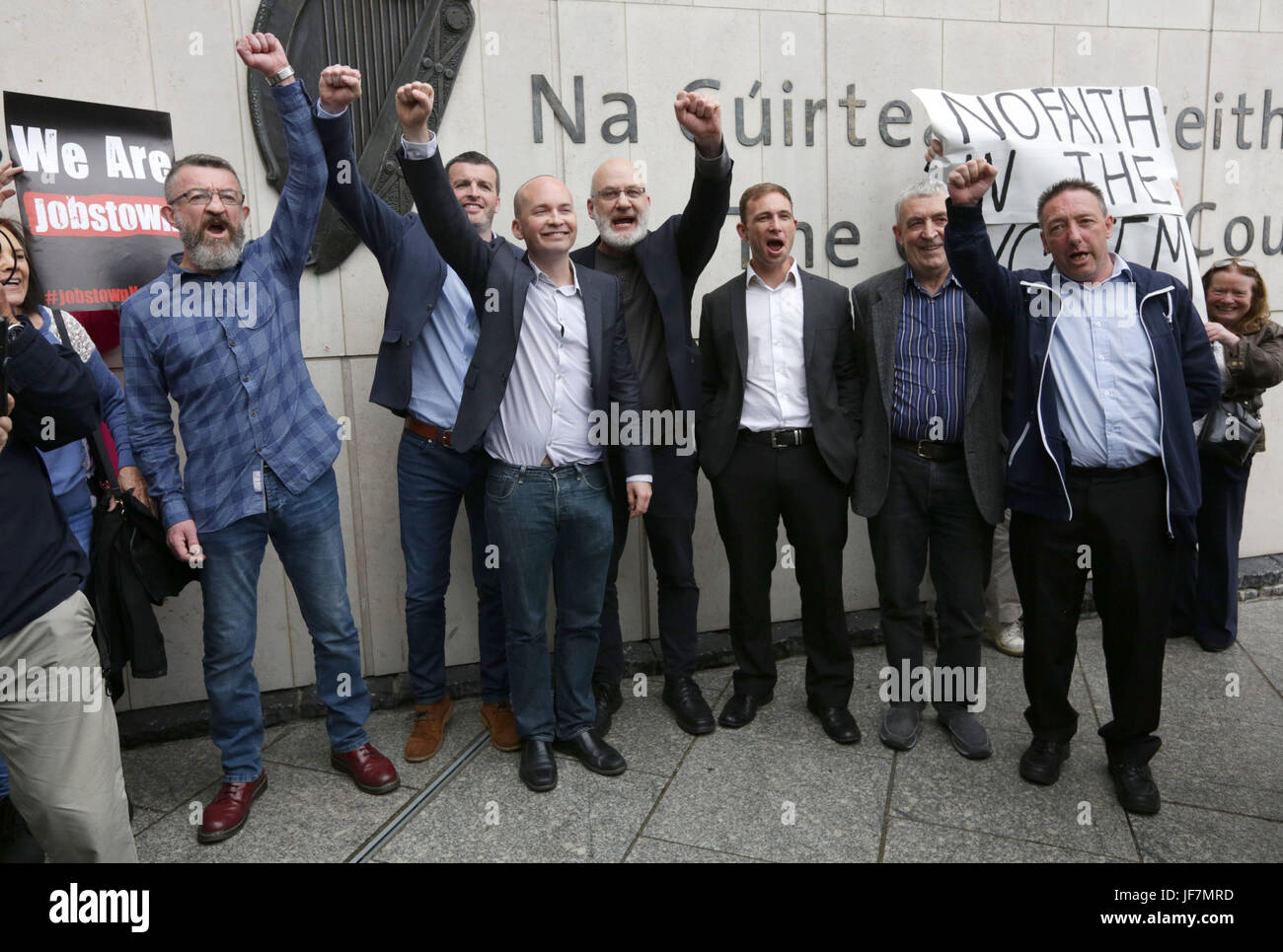 (Left to right) Ken Purcell, Scott Masterson, Paul Murphy TD, Cllr. Michael Murphy, Cllr. Ciaran Mahon, Frank Donaghy, Michael Banks, who were found by a jury at Dublin's Circuit Criminal Court not guilty of restricting the personal liberty of ex-Tanaiste Joan Burton and her then assistant Karen O'Connell on November 15 2014, at Fortunestown Road in Jobstown, Dublin. Stock Photo