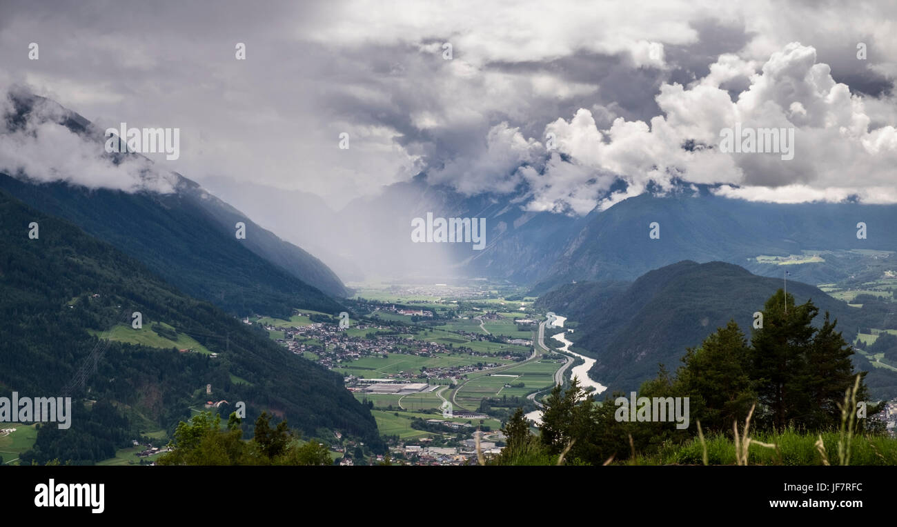 Looking down on rainclouds spreading through the Inn valley from Mosern, Seefeld, Austria Stock Photo