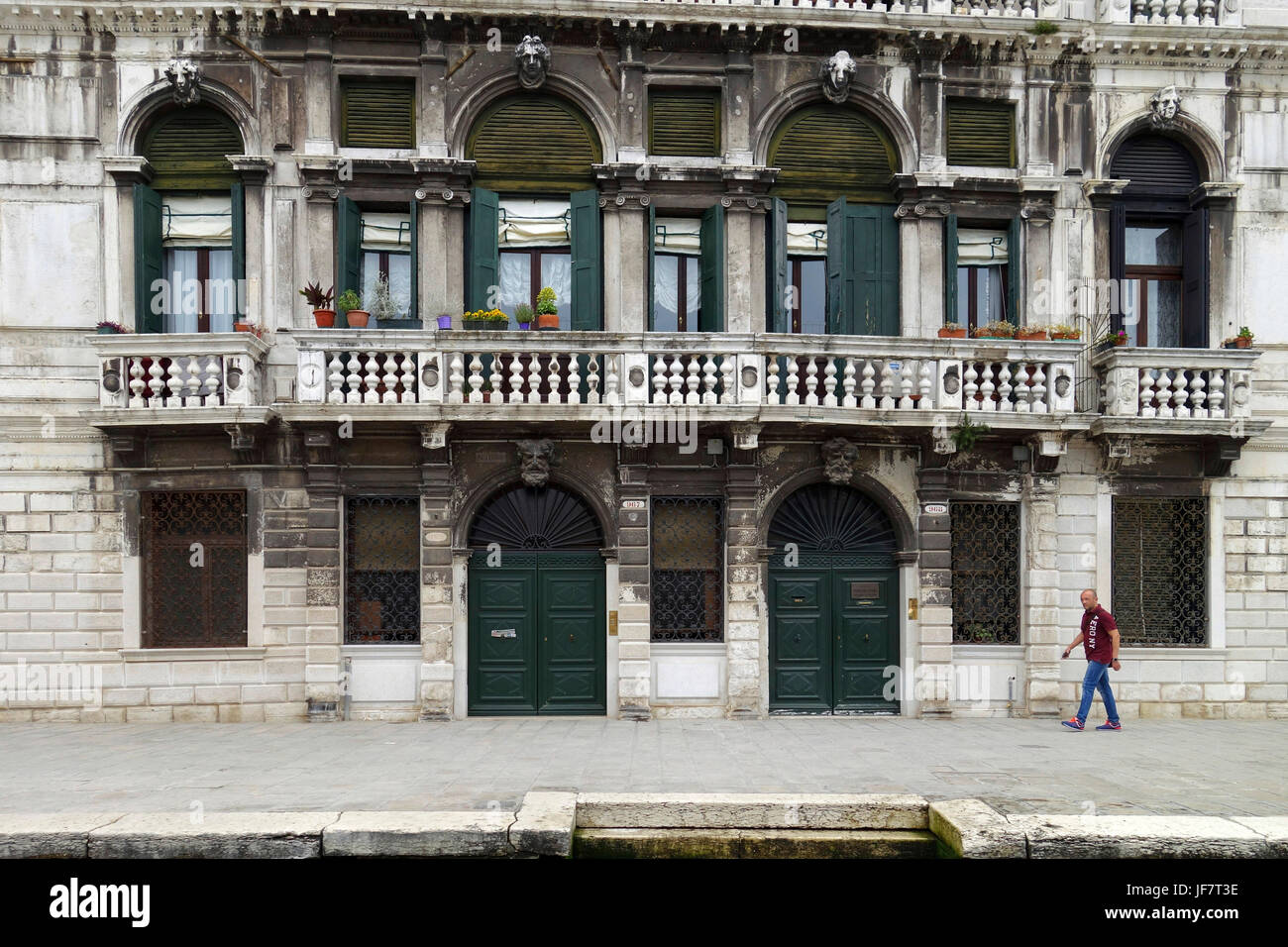 Worn exterior of a building along the Grand Canal, Venice, Italy Stock Photo