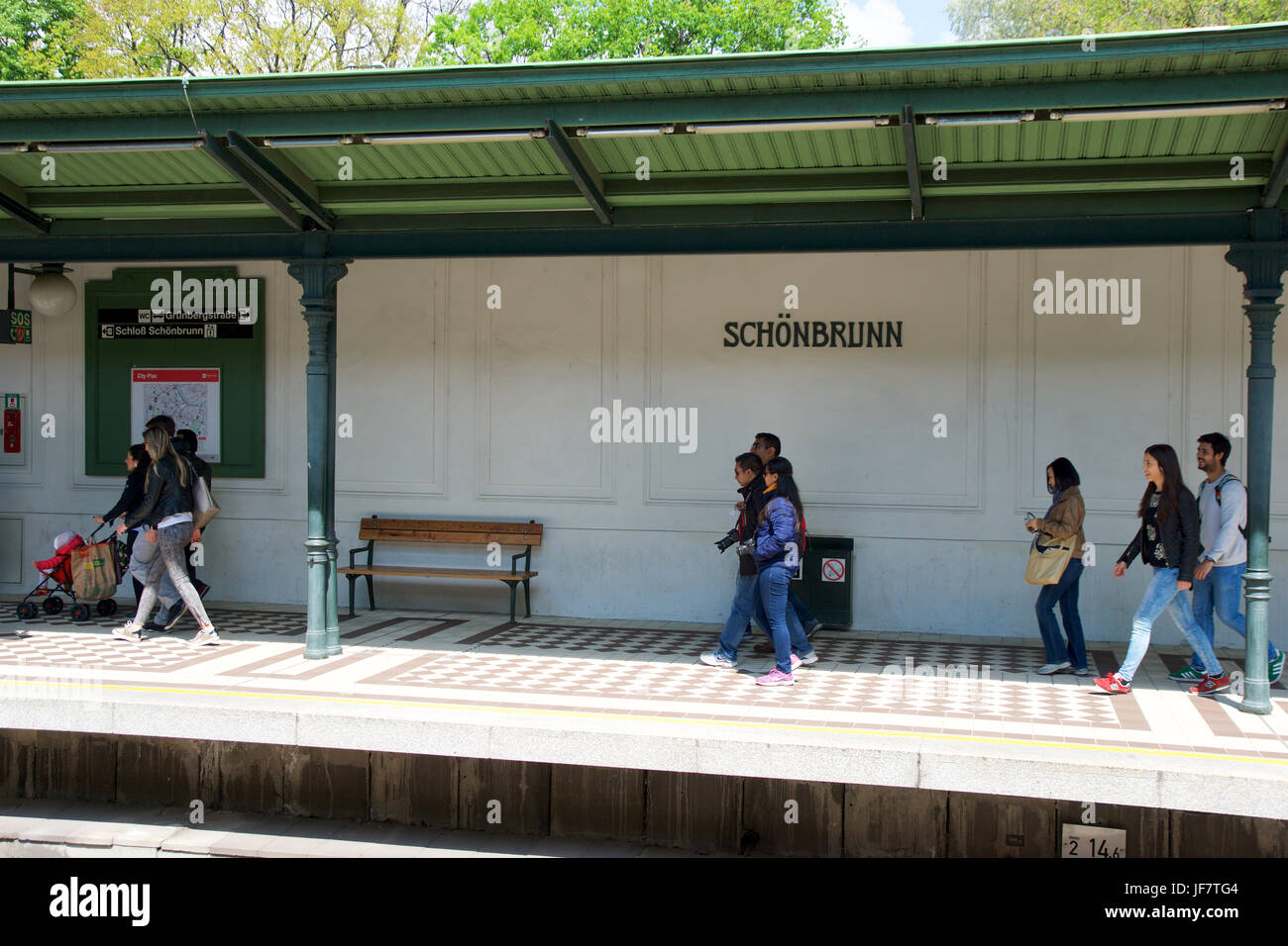 VIENNA, AUSTRIA - APR 30th, 2017: Passengers walking and waiting for a train at the subway or tram station Schonbrunn Palace Stock Photo